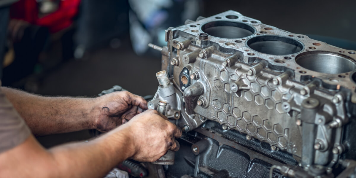 Mechanic repairing a diesel engine